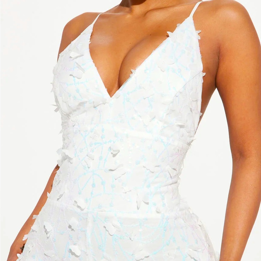 White jumpsuit with butterflies all over